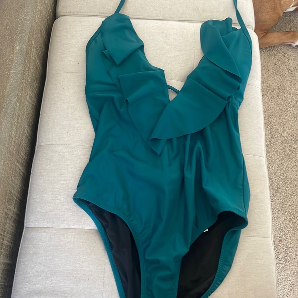 Brand new one pice swim w/ tags! Can be reversible I believe to black!